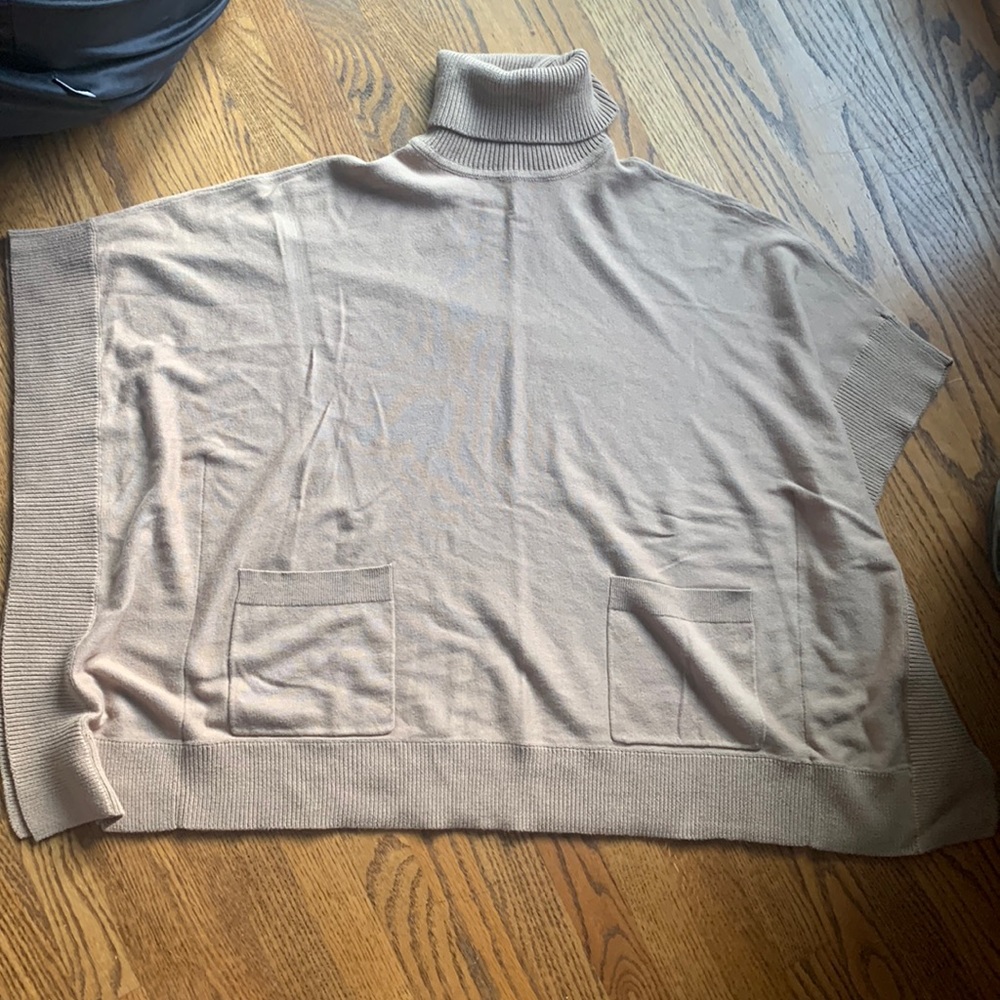 Woman’s Turtle Neck Poncho Sweater